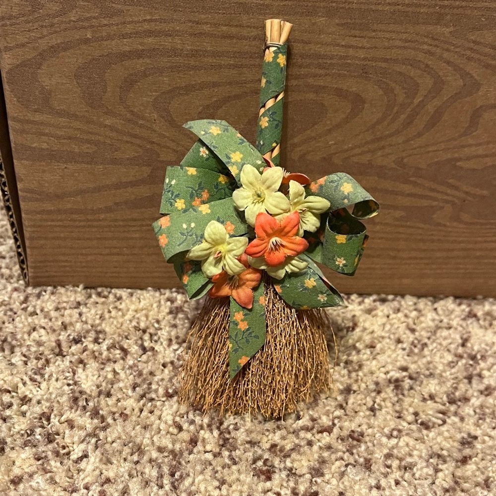 Decorative Floral Broom with Green and Orange Accents